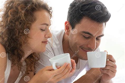 Happy Couples Relaxing In The White Bedroom Stock Image Image Of