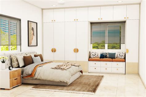 Guest Bedroom Design With Bay Window Seating And White Wardrobe Livspace