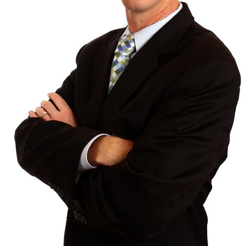 Free Stock Photo Of A Young Businessman In A Suit Crossing His Arms