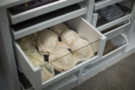 Lingerie Hanging In A Closet And Lying On A Shelf Stock Image Image