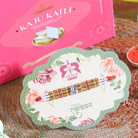 Buy Send Om Rakhi Kaju Katli Online Floraindia