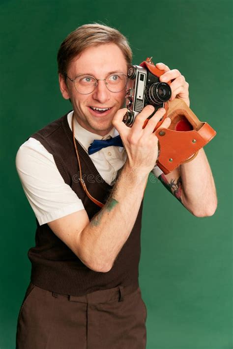 Amateur Photographer Portrait Of Man In Stylish Classical Clothes Shorts And Vest Posing Over