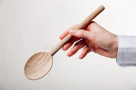 Hand Holding Wooden Spoon Stock Photo Image Of White 20473478