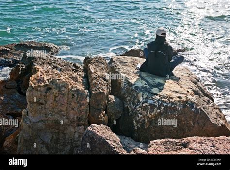 -Alone Woman on the Rock- Gold Coast (Spain Stock Photo - Alamy