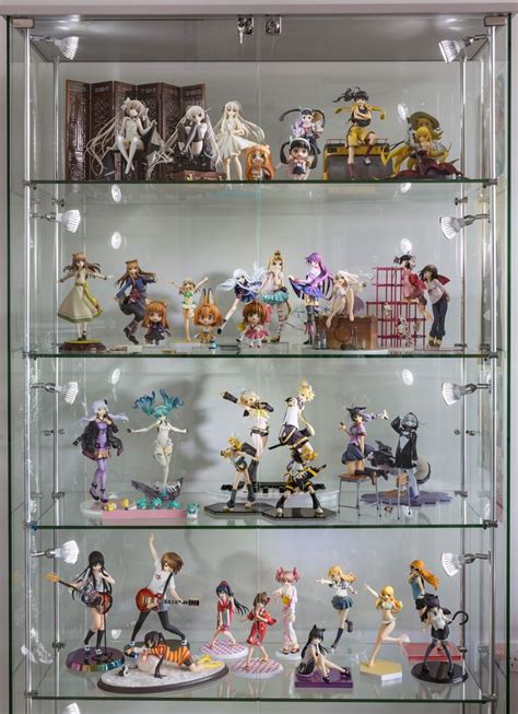 A Display Case Filled With Lots Of Anime Figurines On Glass Shelves Next To Each Other