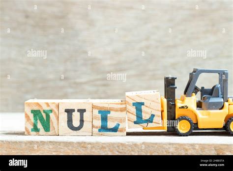 Toy Forklift Hold Letter Block L To Complete Word Null On Wood