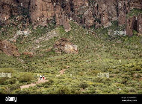 Couple hiking at Lost Dutchman State Park, Arizona Stock Photo - Alamy