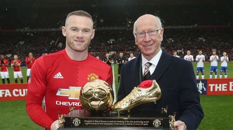 Wayne Rooney handed trophy by Sir Bobby Charlton after becoming ...