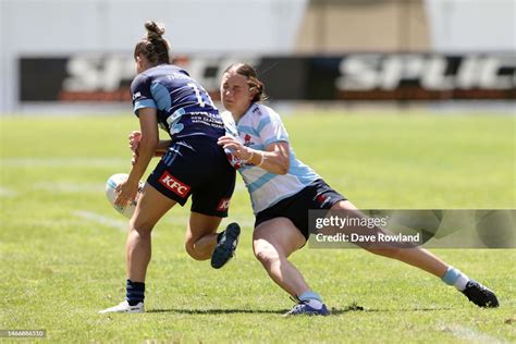 Caitlyn Halse Of The Waratahs Tackles Jaymie Kolose Of The Blues
