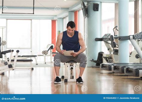 Handsome Personal Trainer With A Clipboard Stock Photo Image Of