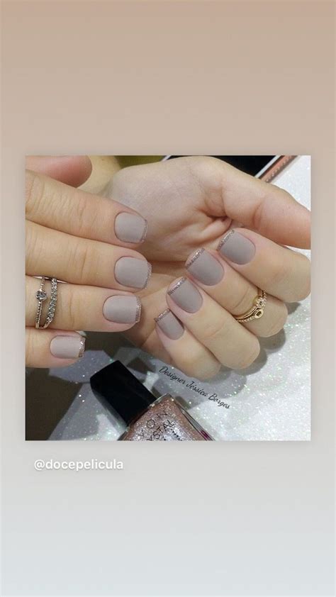 Two Hands With Manicured Nails Holding Each Other