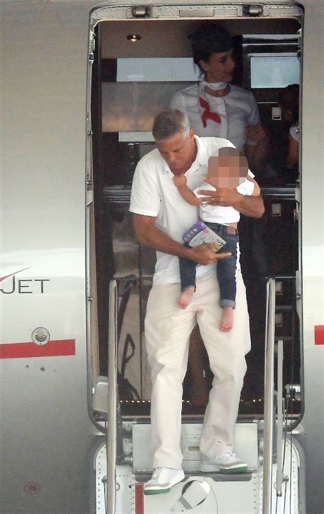 George Clooney And Wife Amal Cradle Their Twins As They