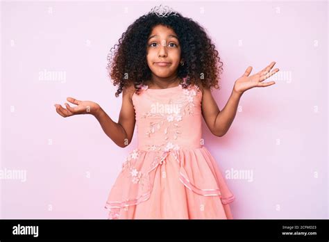 African American Child With Curly Hair Wearing Princess Crown Clueless