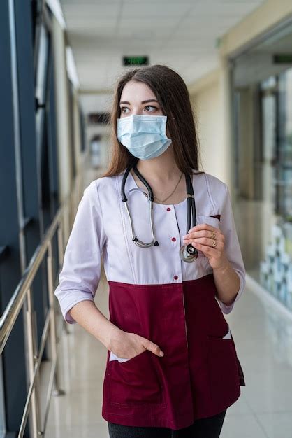 Premium Photo Portrait Of A Successful Smiling Nurse Wearing A Mask