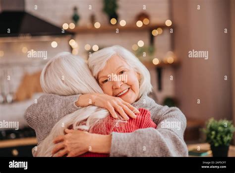 Two Mature Grey Haired Positive Ladies Feeling Happy Stock Photo Alamy