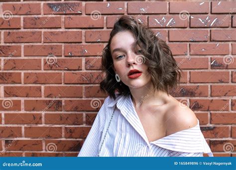 Close Up Portrait Of The Beautiful Brunette Girl With Short Wavy Hair