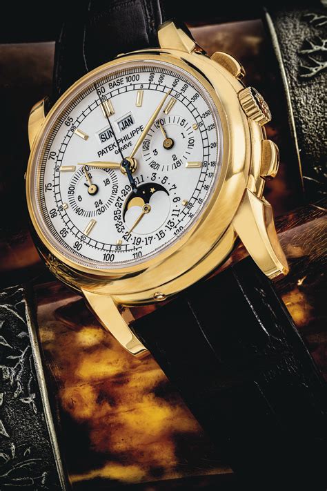 PATEK PHILIPPE. AN 18K GOLD PERPETUAL CALENDAR CHRONOGRAPH WRISTWATCH ...