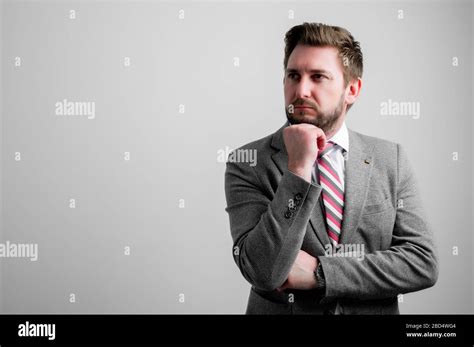 Portrait Of Business Man Wearing Business Clothes Making Thinking