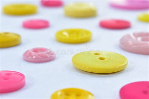 Yellow and Pink Sewing Buttons on White Stock Image - Image of yellow ...