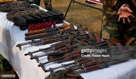 Indian Army Soldiers Arrange Seized Arms And Ammunitions Recovered