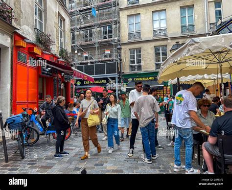 Paris France Large Crowd Of People Tourists Walking Visiting Le