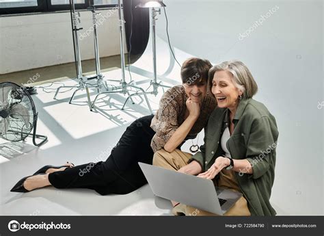Middle Aged Lesbian Couple Sitting Peacefully White Floor Photo Studio