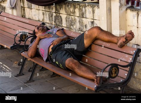 Homeless Man Sleeping Peacefully On Wooden Bench Stock Photo Alamy