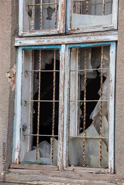 Old Window With Worn Wooden Shutters On Exterior Wall Of An Old Ruined Houseold Window With Worn