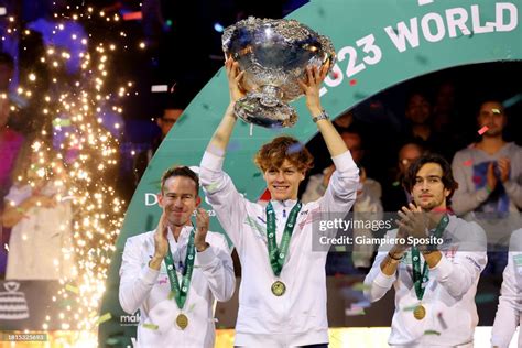 Jannik Sinner of Italy holds the Davis Cup Trophy after their teams ...