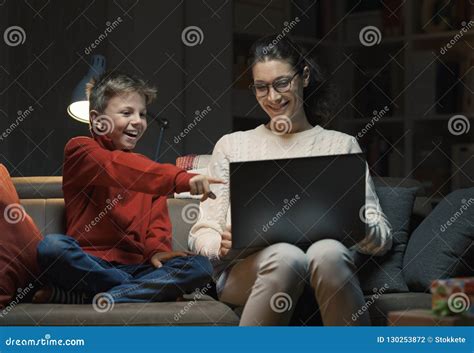 Mother And Son Watching Movies On A Laptop Stock Photo Image Of Room