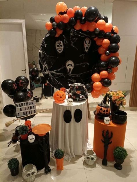 An Assortment Of Halloween Decorations And Balloons