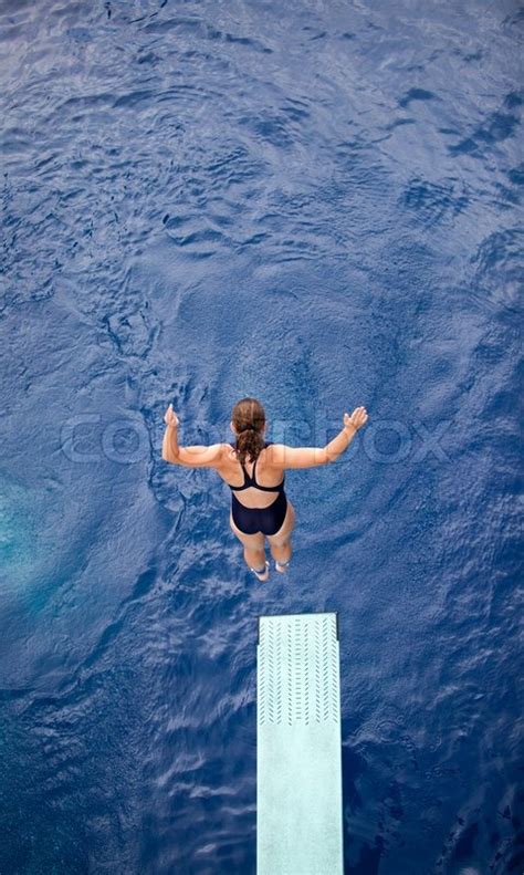 Female Springboard Diver Diving Into Stock Image Colourbox