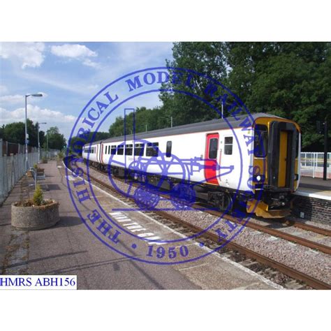 [abh156] 156419 Dmu In Greater Anglia White Body And Red Door Livery Three Quarter View Of