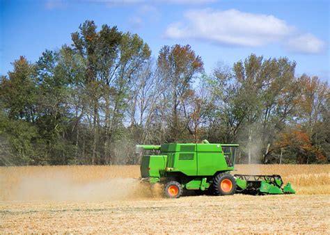 Farmer Using Machinery To Harvest His Crops in the Fall. Stock Photo ...