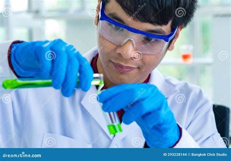 Closeup Shot Hands Of Asian Male Scientist In White Lab Coat Safety Goggles And Rubber Gloves In