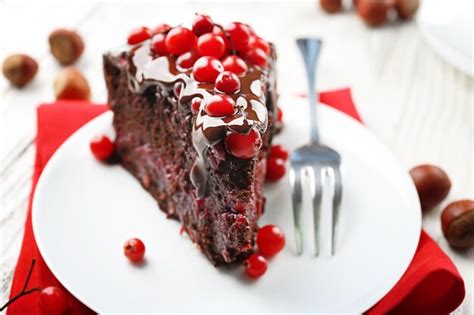 Premium Photo Piece Of Chocolate Cake With Cranberries On Plate With