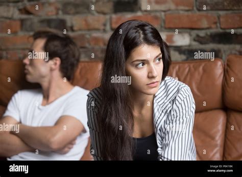 Angry couple avoiding talking after family fight Stock Photo - Alamy