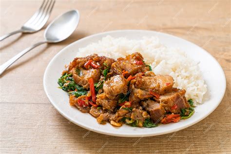 Premium Photo Stir Fried Crispy Pork Belly And Basil With Rice