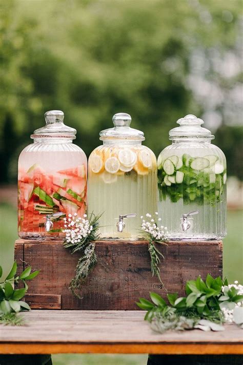 Three Glass Jars Filled With Different Types Of Food On Top Of A Wooden