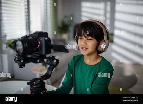 Happy Multiracial Boy Cameraman Amateur With Headphones At Home Stock Photo Alamy