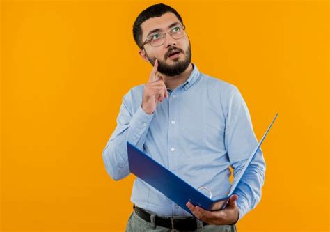 Free Photo Young Bearded Man In Glasses And Blue Shirt Holding Folder