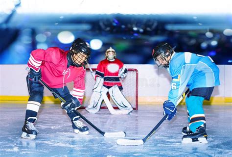 Young Hockey Defenseman in Action on Ice Rink Stock Image - Image of ...