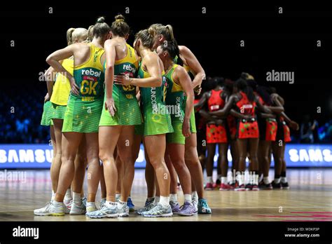 Australia And Malawi Players Huddle After The Final Whistle During The