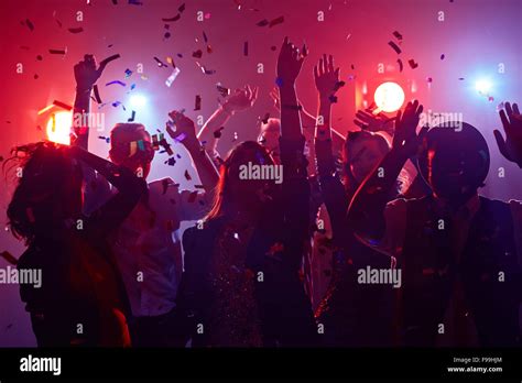 Young people dancing in night club Stock Photo - Alamy