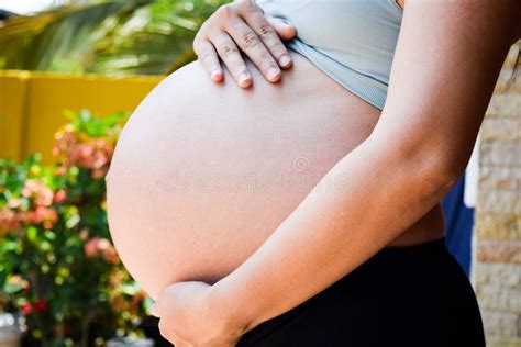 Pregnant Woman Holding Her Hands On Her Stomach Stock Photo Image Of