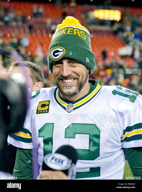 Green Bay Packers quarterback Aaron Rodgers (12) is all smiles as he ...