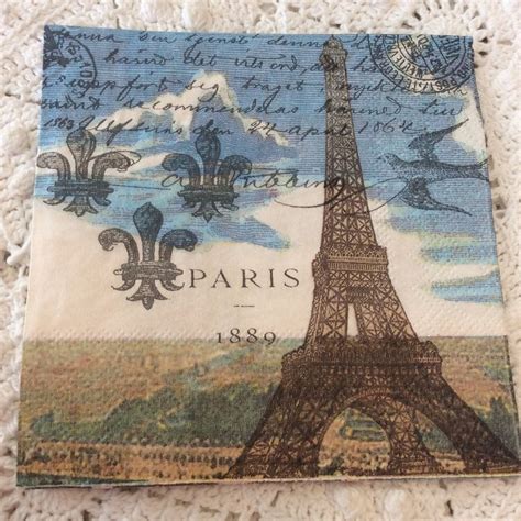 The Eiffel Tower Has Been Made From Fabric And Is Sitting On A Doily