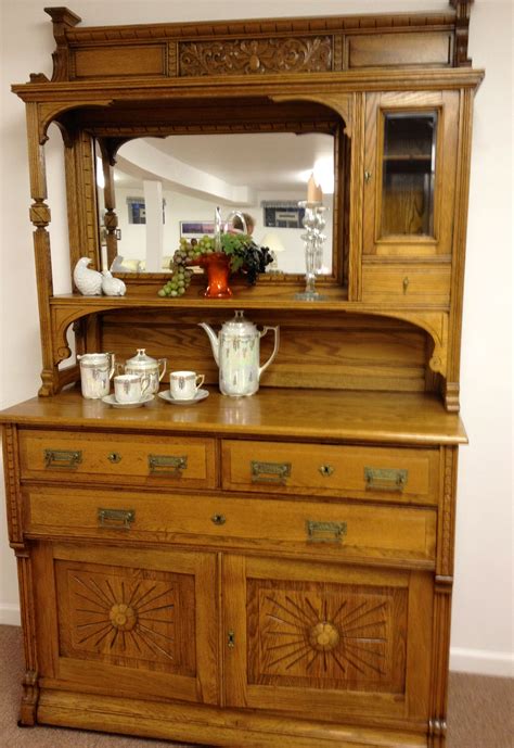 This beautiful mirror-back buffet with cabinets has been lovingly kept ...