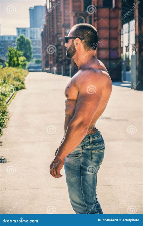 Handsome Muscular Shirtless Hunk Man Outdoor In City Setting Stock