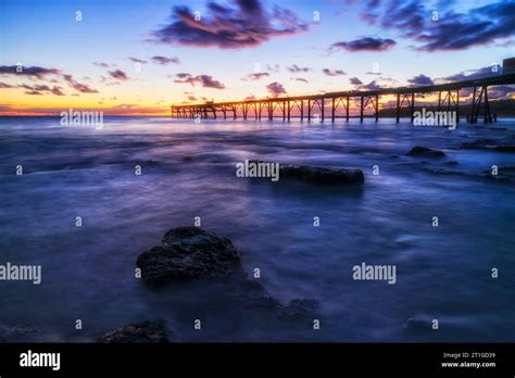 Dark Scenic Seascape Sunrise Over Pacific Ocean Horizon Behind Historic